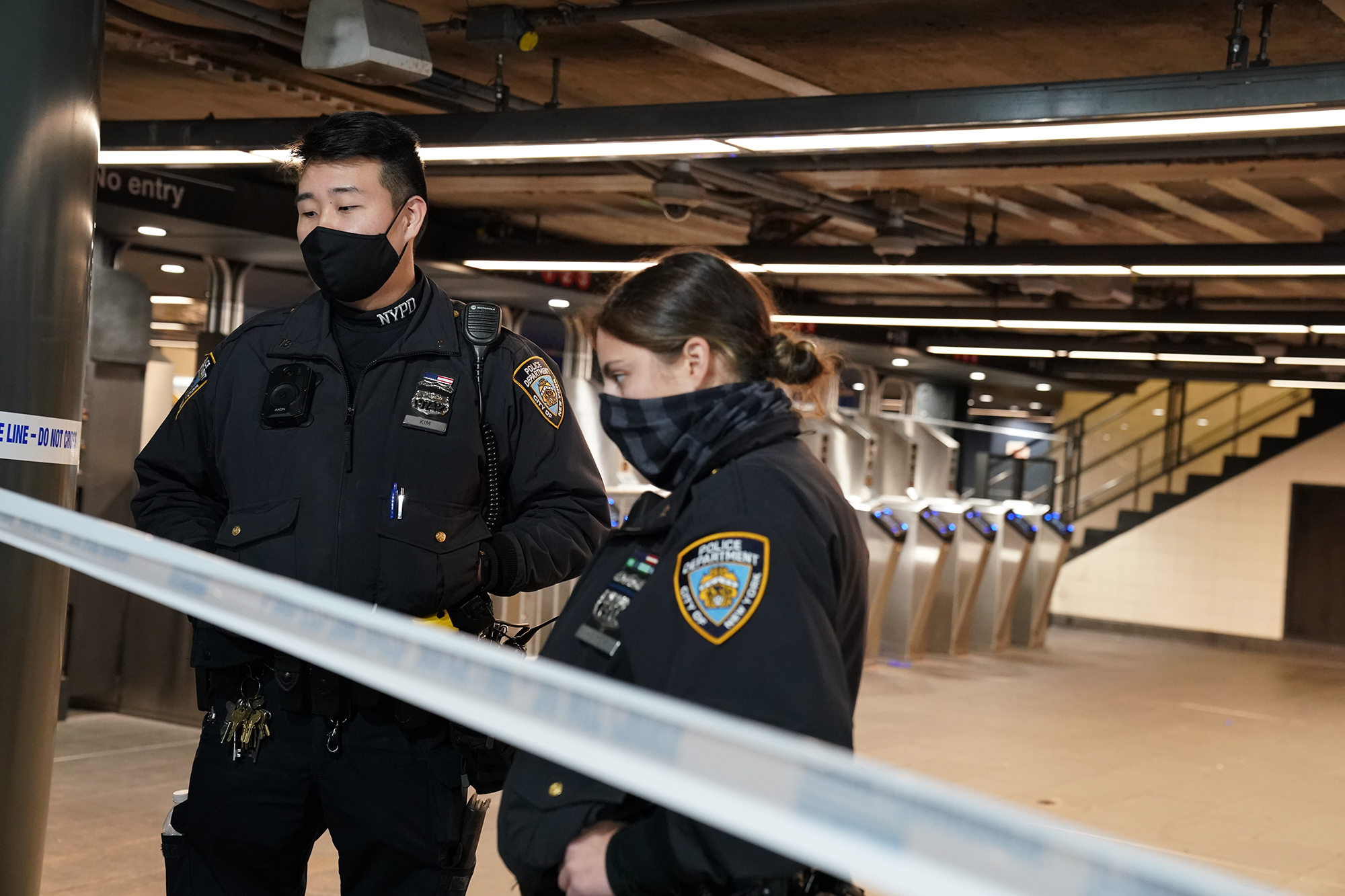 Police officers respond at the scene of the stabbing.