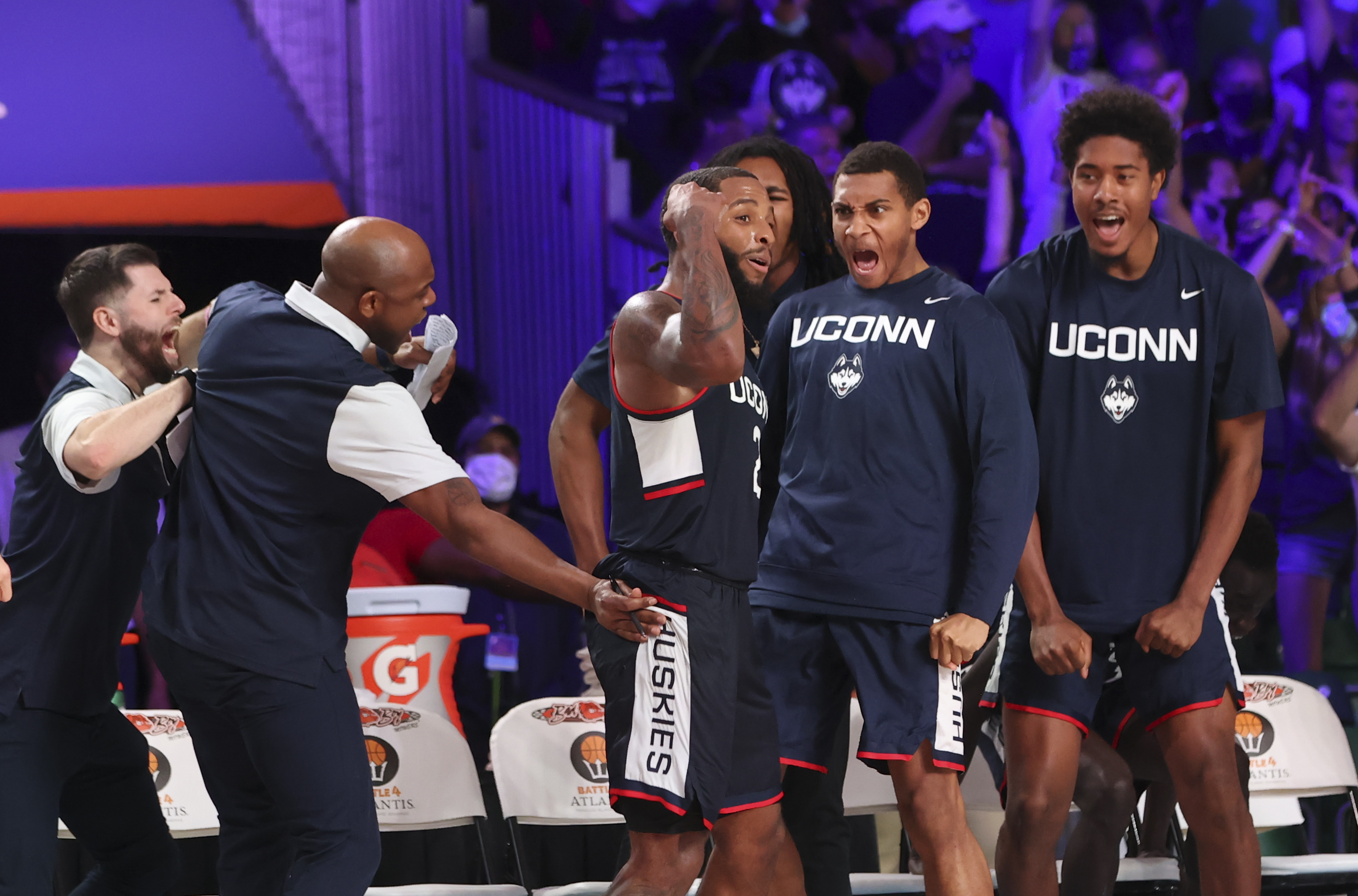 UConn guard R.J. Cole celebrates with teammates after scoring during a game against Auburn in the 2021 Battle 4 Atlantis at Imperial Arena.