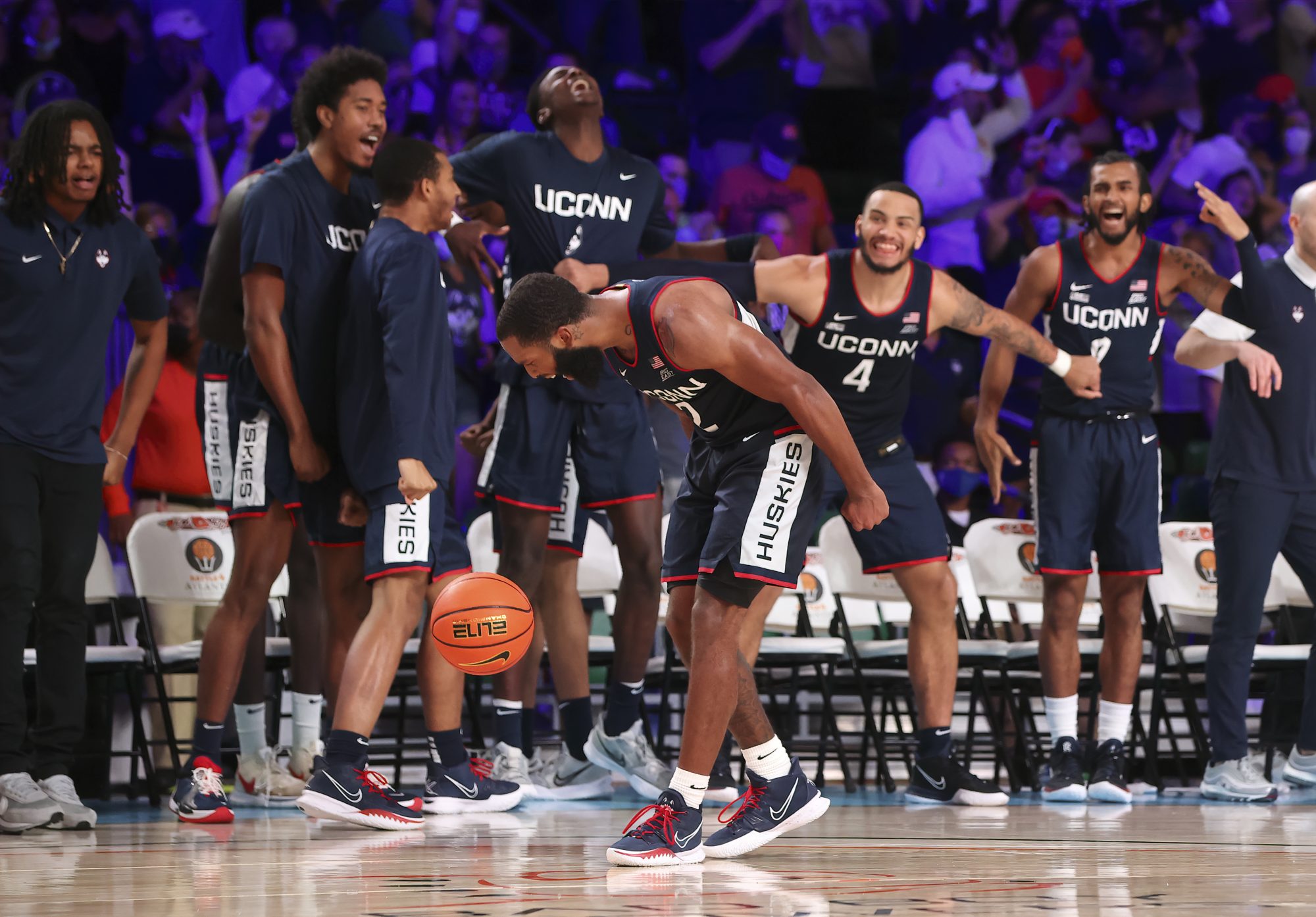 UConn guard R.J. Cole celebrates with teammates after scoring during a game against Auburn in the 2021 Battle 4 Atlantis at Imperial Arena.