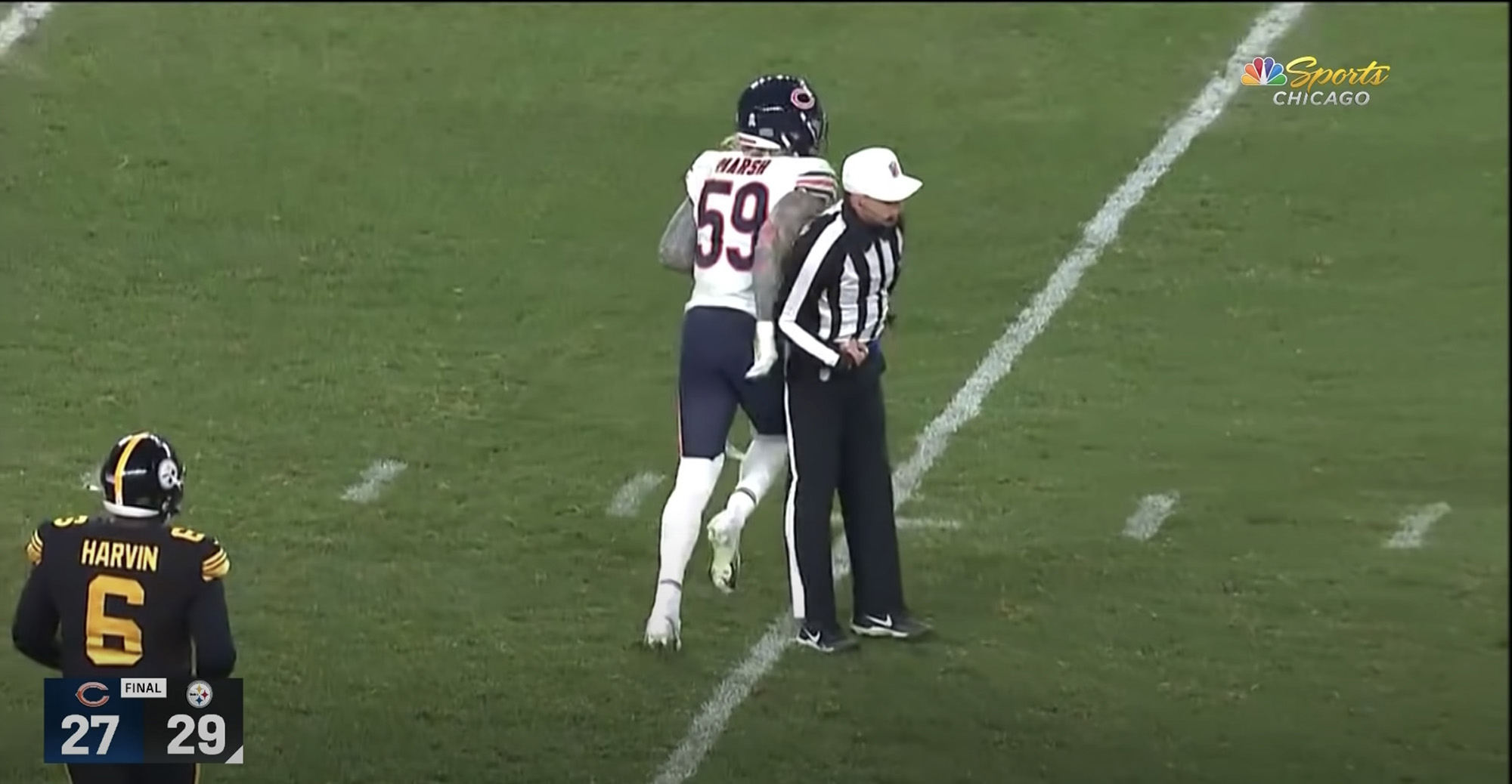 Referee Tony Corrente bumps Bears' Cassius Marsh right before flagging him for taunting. 