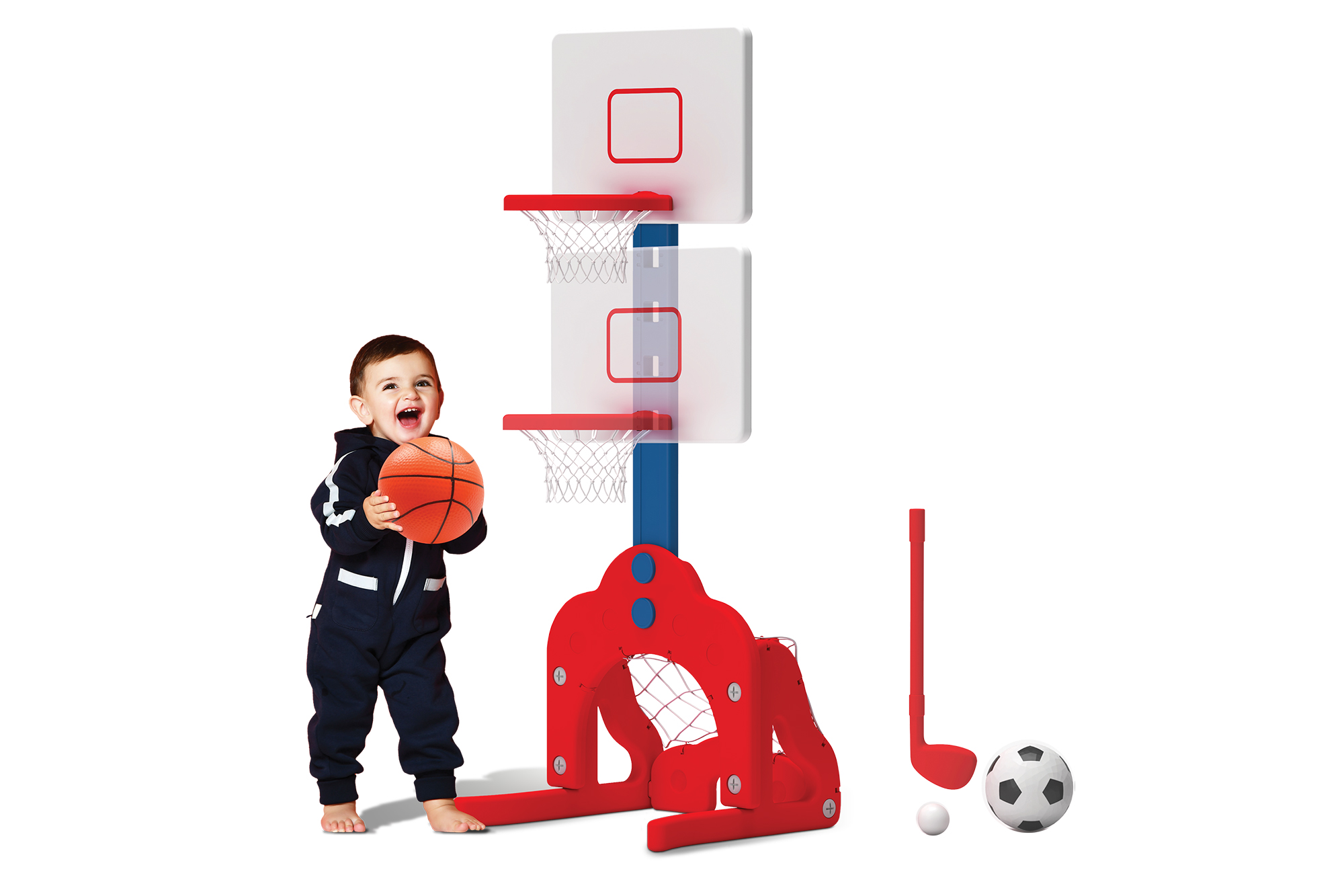 A baby shooting a basket ball into a child's hoop and other sports equipment 