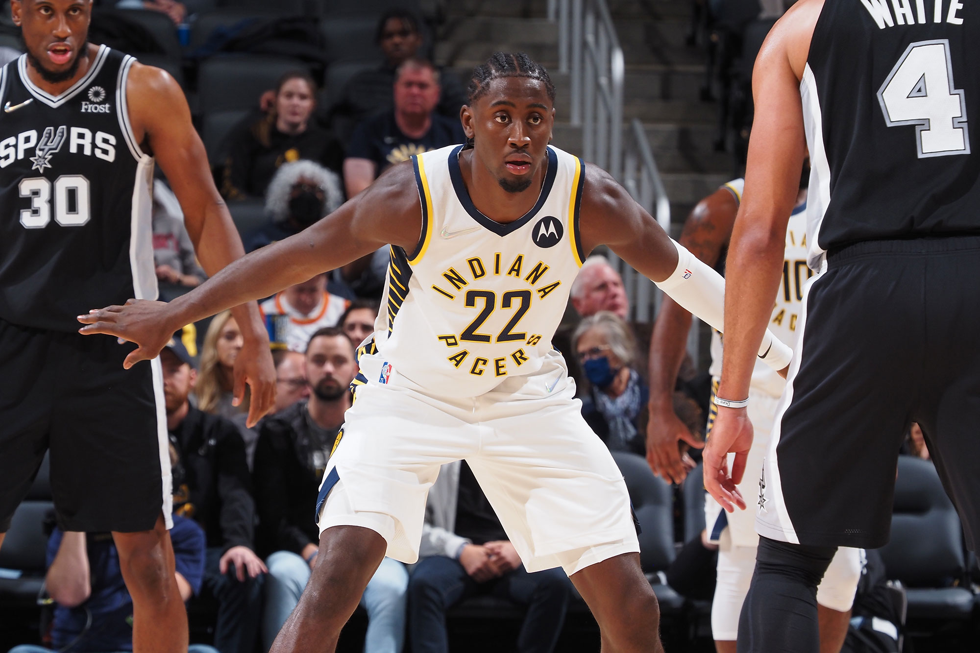 Caris LeVert #22 of the Indiana Pacers defends the ball