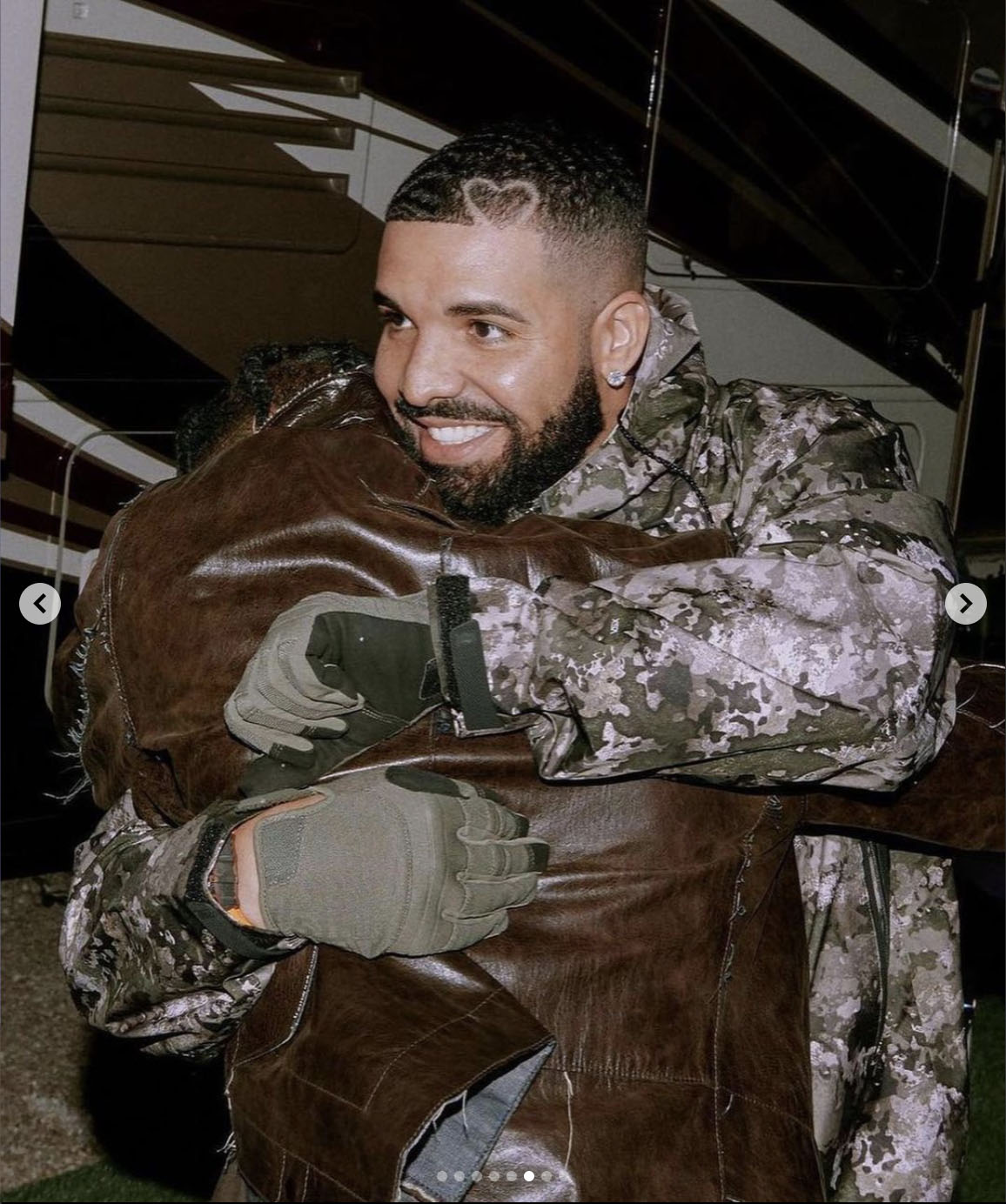 Drake and Travis Scott embrace at Astroworld Festival in Houston.