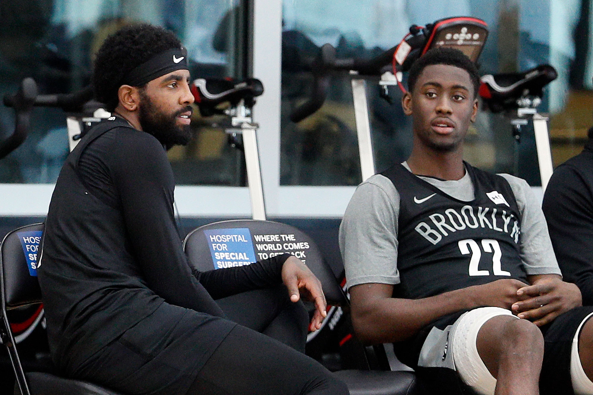 Kyrie Irving #11 of the Brooklyn Nets talks with Caris LeVert #22 of the Brooklyn Nets during practice