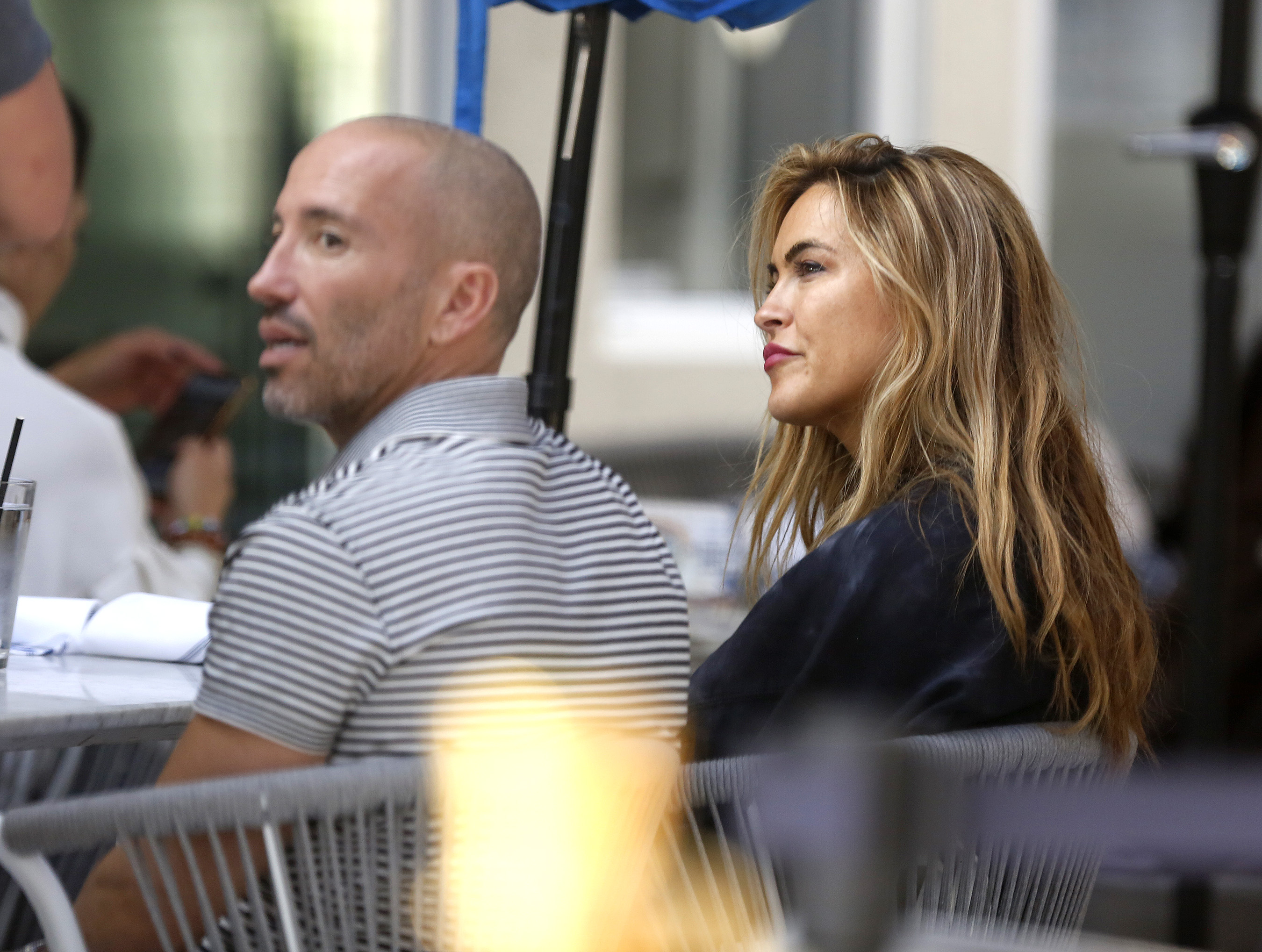 EXCLUSIVEPhoto Credit: MOVI Inc.  November 9th 2021Chrishell Stause and Jason Oppenheim loved up in L.A! The 'Selling Sunset' pair's relationship still seems to be going strong as the pair cuddle and kiss during an alfresco lunch in West Hollywood,CA