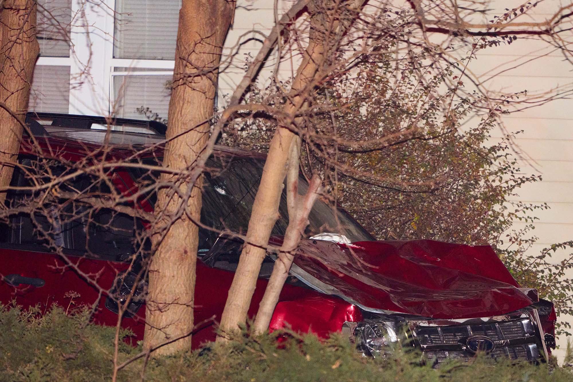 The suspect vehicle on Maple Avenue after a driver blew past police and drove into a crowd at a holiday parade in Waukesha, Wisconsin.