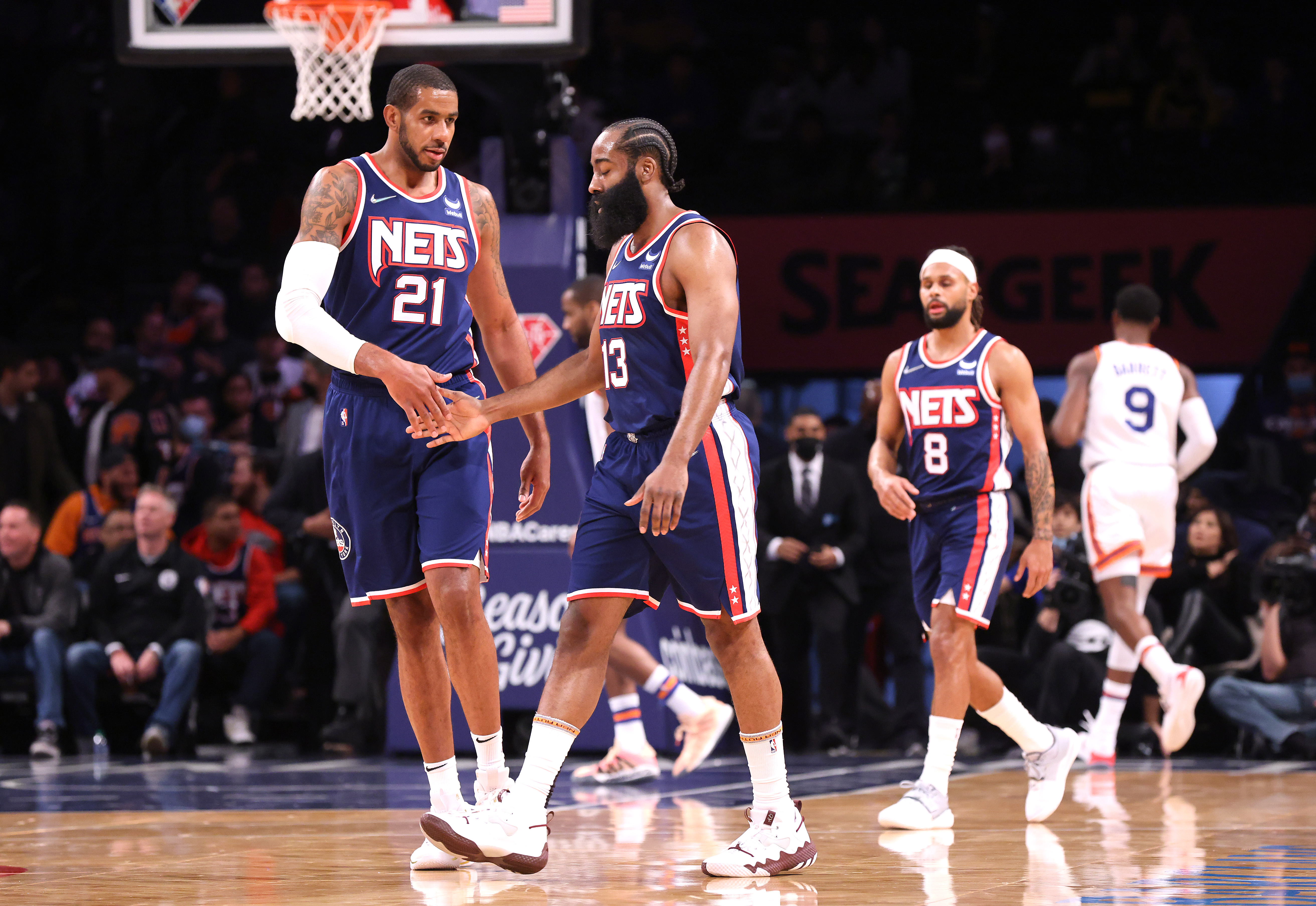 Nets center LaMarcus Aldridge greets guard James Harden after a shot during the first quarter of a game against the Knicks at Madison Square Garden on Nov. 30, 2021.