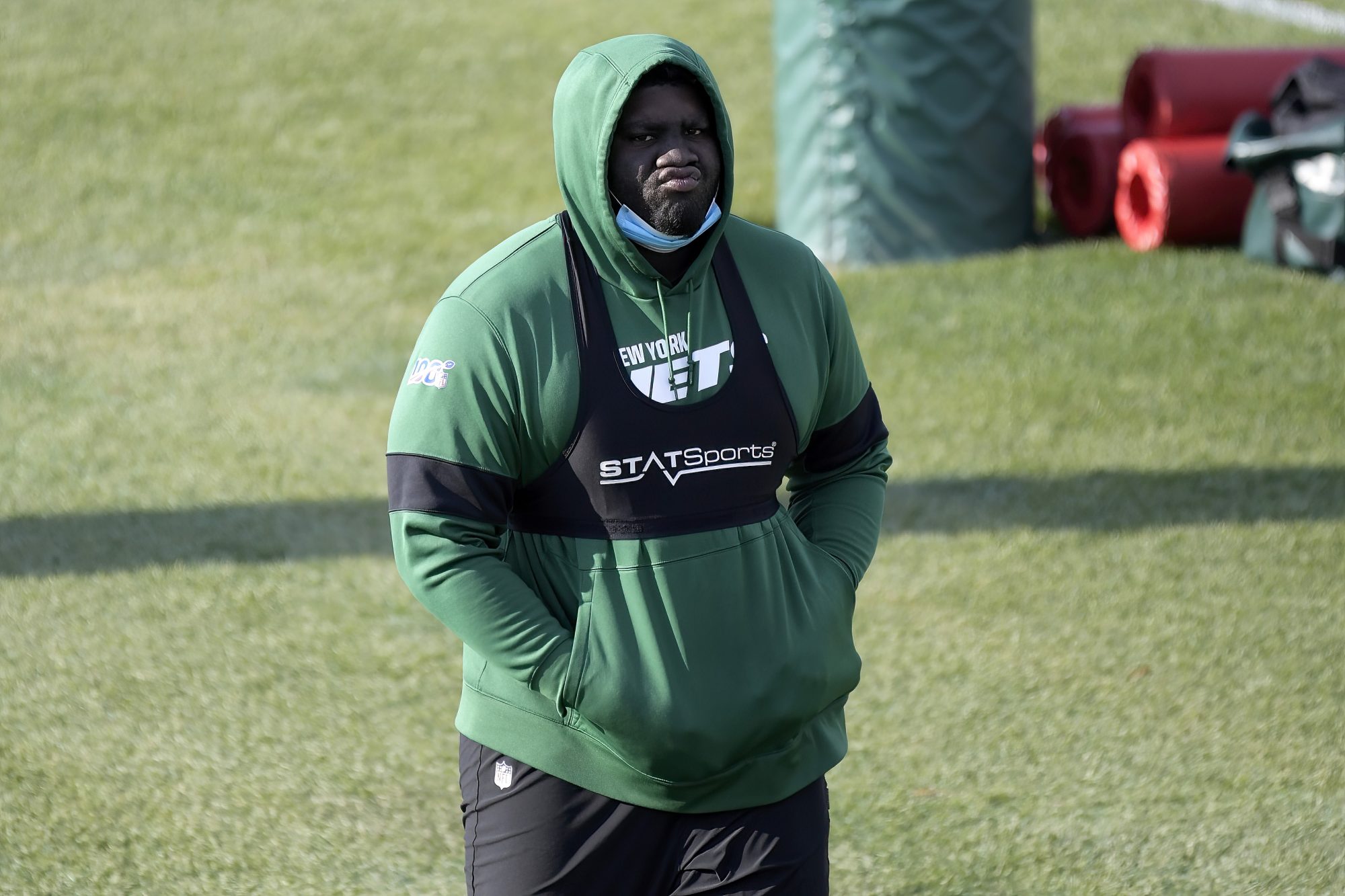 Jets offensive tackle Mekhi Becton looks on at practice in Florham Park, N.J.