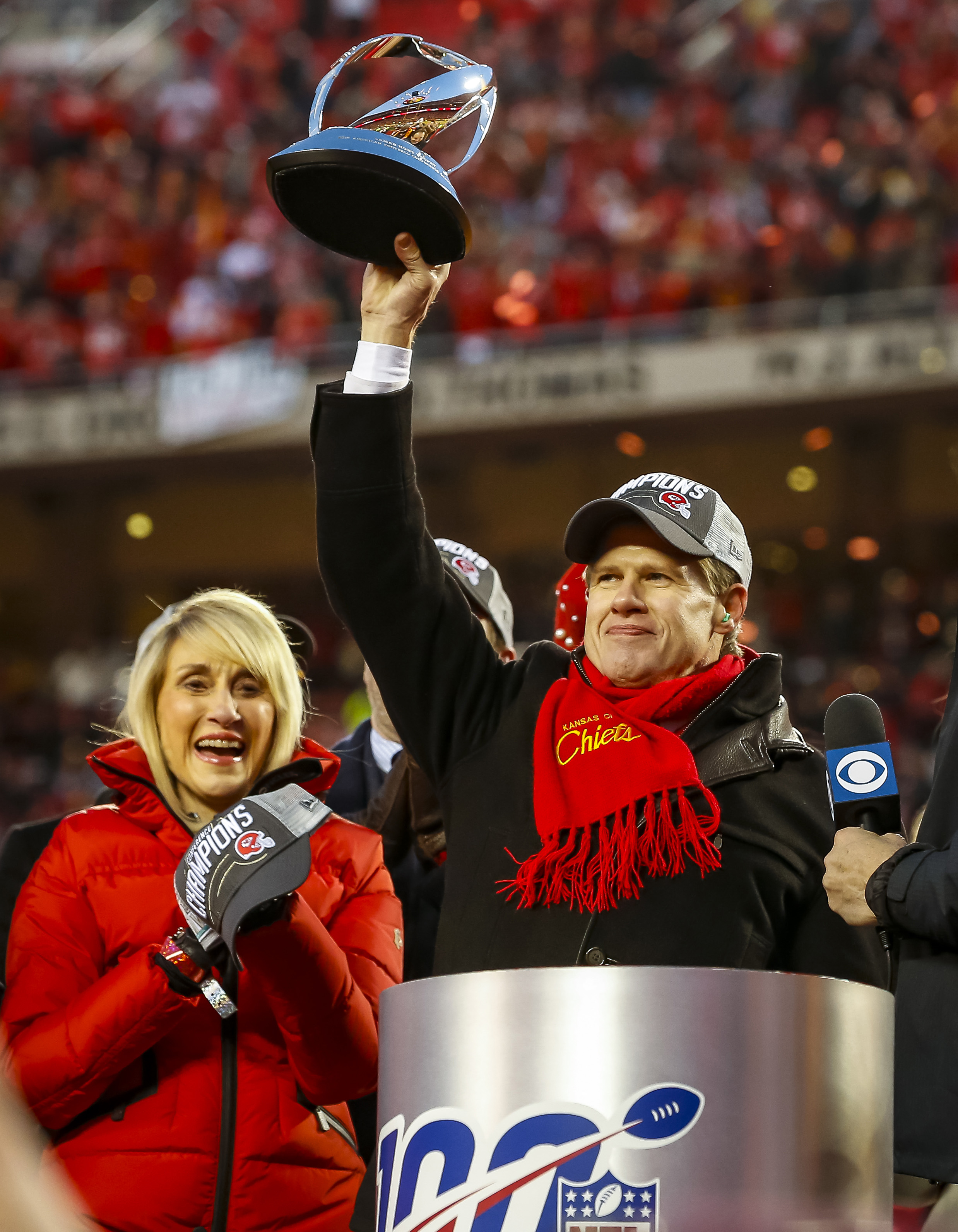 Clark Hunt holds up the Lamar Hunt trophy beside his mother, Norma Hunt,  after the Chiefs defeated the Titans in the AFC Championship Game on Jan. 19, 2020.