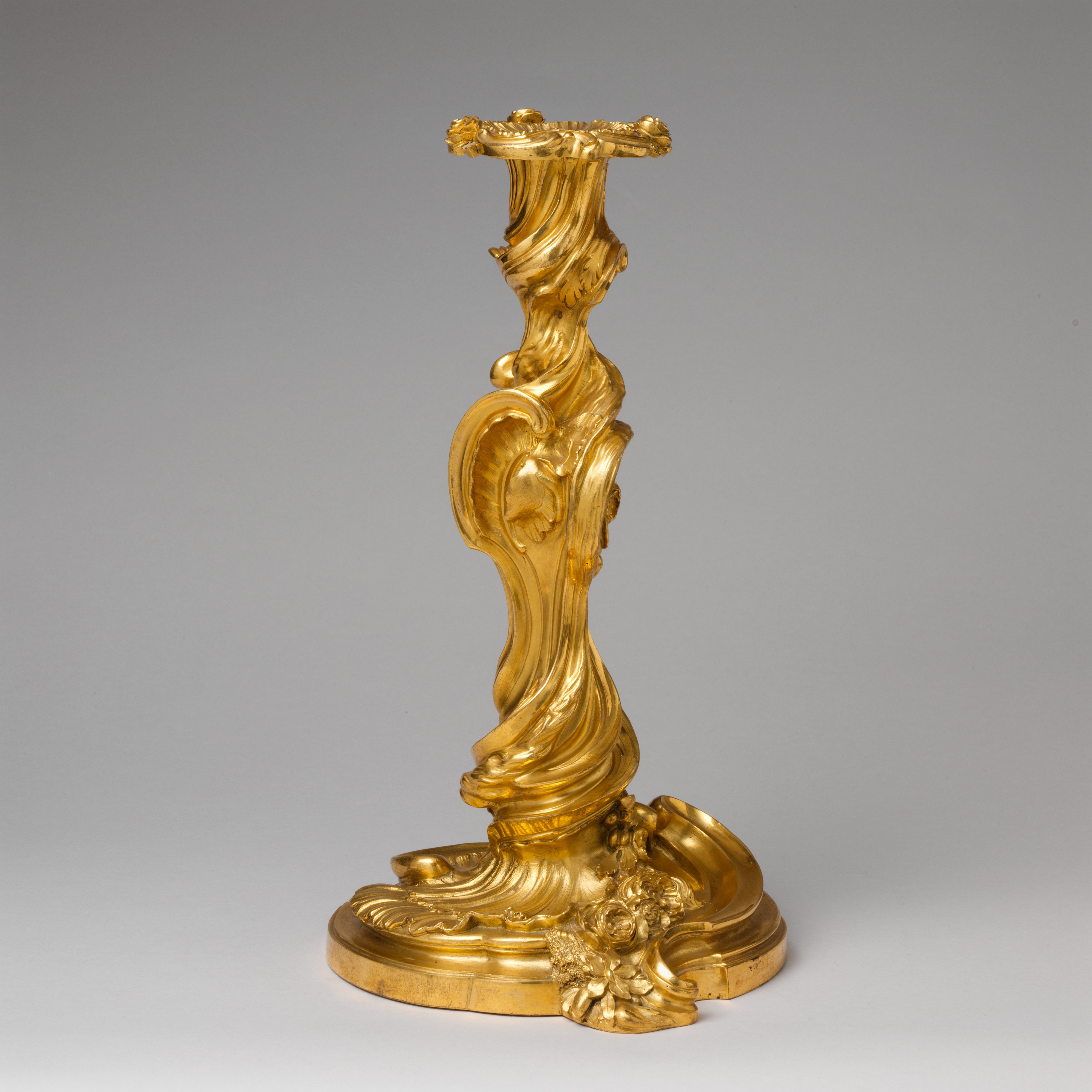 The inspiration for Lumiere came from Rococo candlesticks. This one, by Meissonnier, is a good example for showing its abstract shapes bringing movement to an otherwise inanimate object.