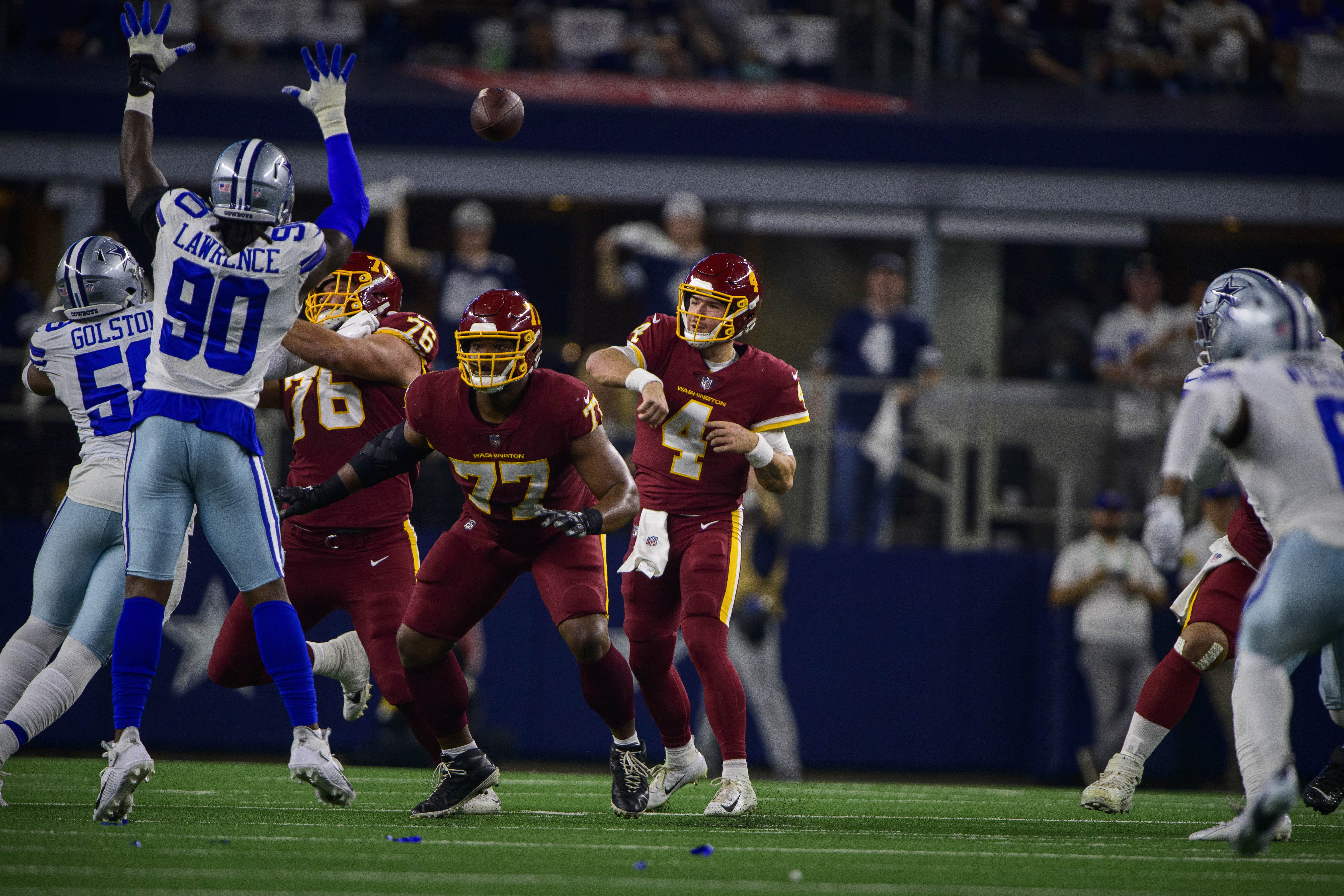 Demarcus Lawrence bats Taylor Heinicke's pass to himself before intercepting it and returning it for a touchdown. 