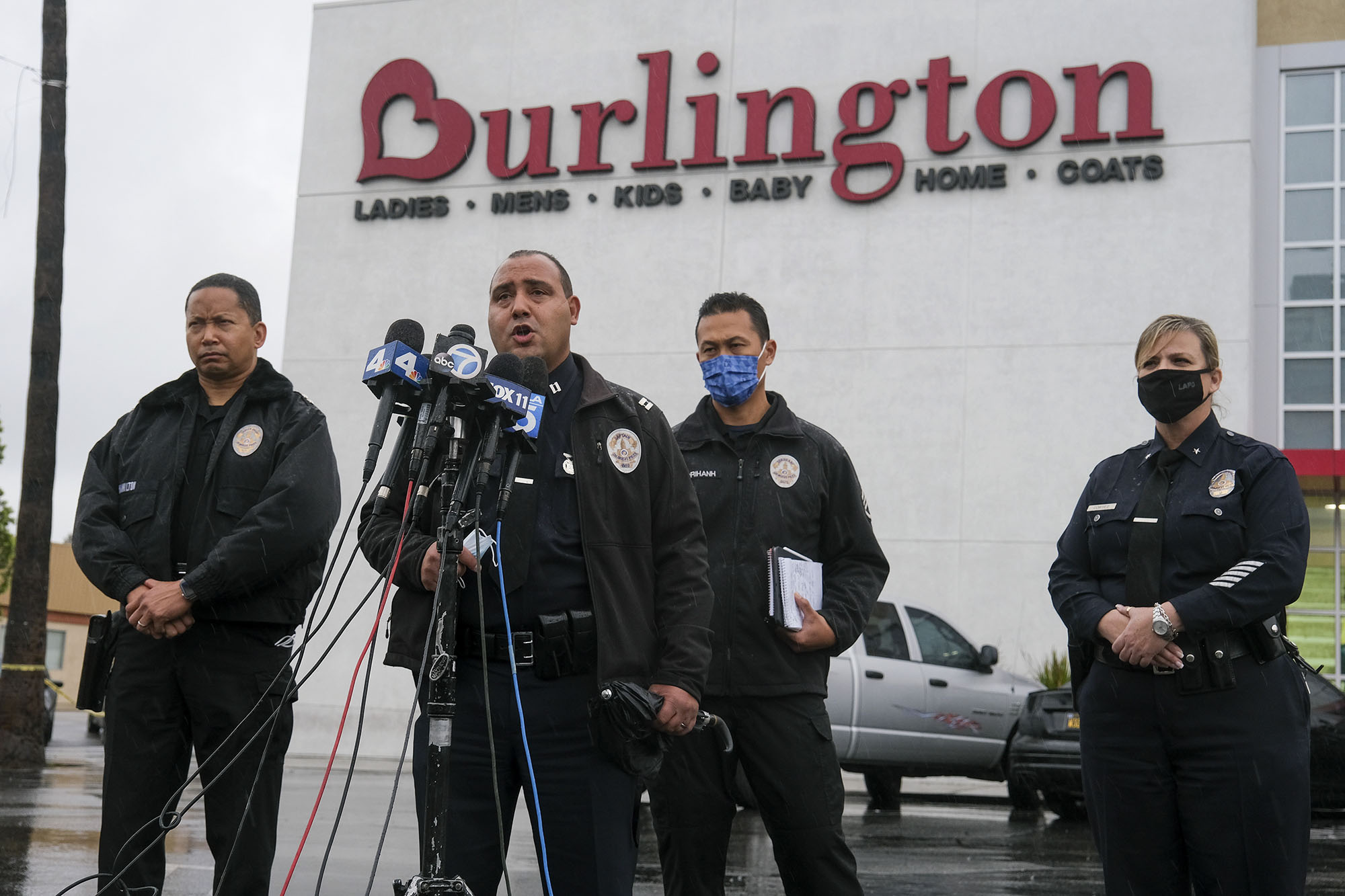 Los Angeles Police Department PIO Capt. Stacy Spell, second from left, speaks in a press conference