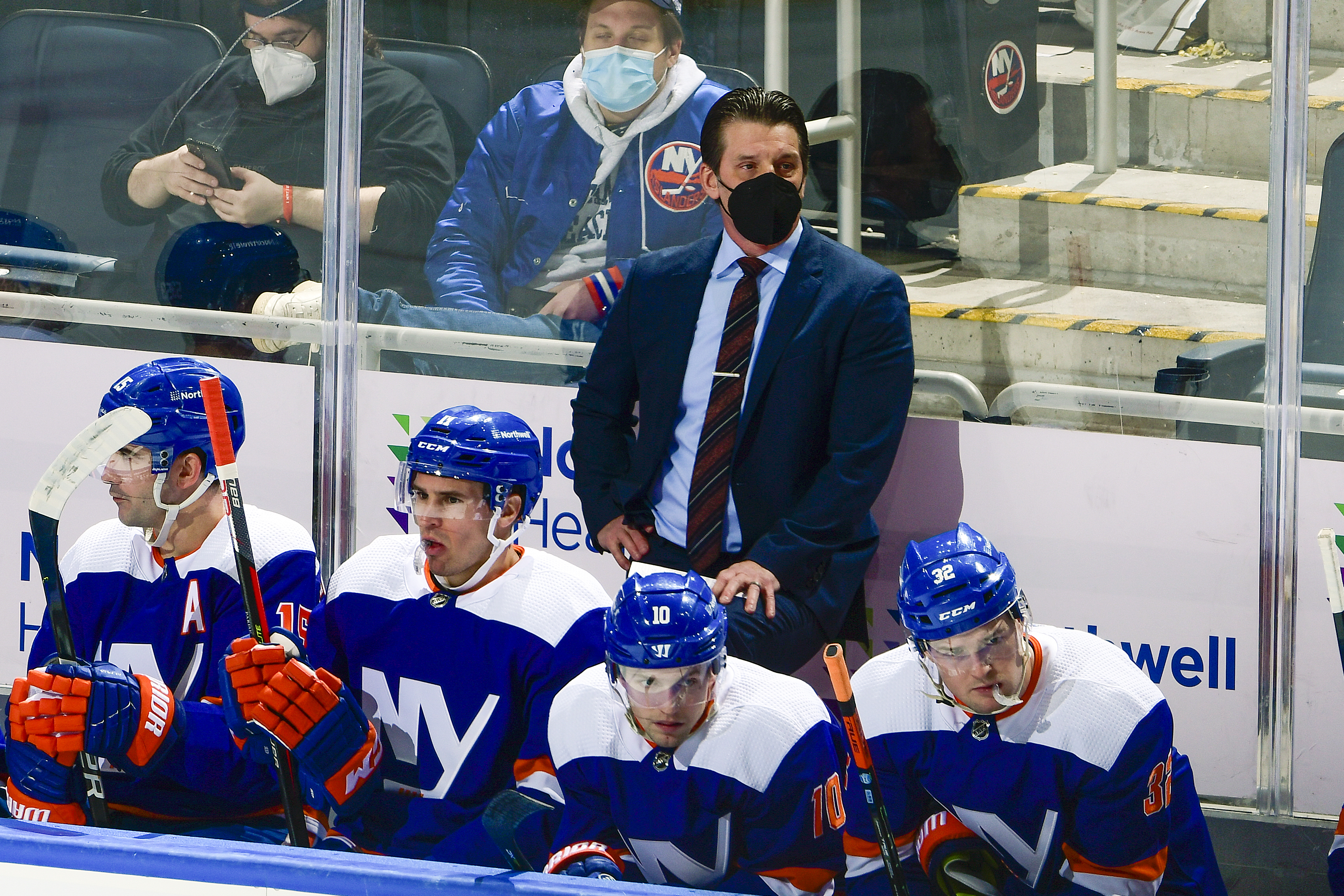 Lane Lambert looks on the Islanders' bench during their 3-2 overtime win over the Oilers.