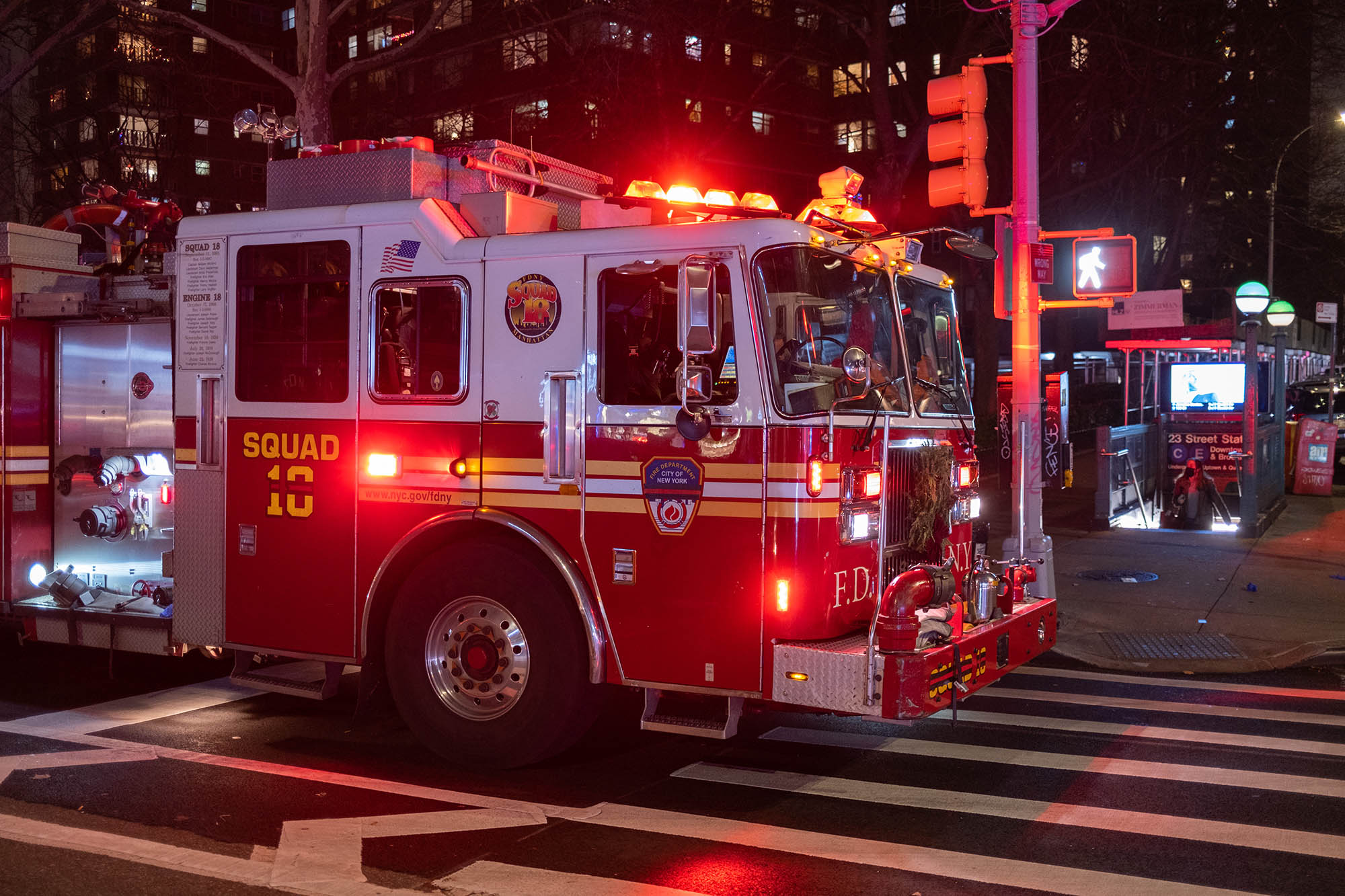 FDNY vehicle at night with emergency lights on.
